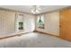 Bedroom featuring neutral carpet and floral wallpaper at 6430 E Southport Rd, Indianapolis, IN 46237