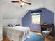 Bedroom with bed, desk and a ceiling fan at 6430 E Southport Rd, Indianapolis, IN 46237