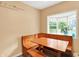 Charming breakfast nook with built-in seating next to a window at 6430 E Southport Rd, Indianapolis, IN 46237
