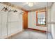 Walk-in closet featuring neutral carpet, metal racking, and window at 6430 E Southport Rd, Indianapolis, IN 46237