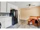 Eat-in kitchen featuring a breakfast nook and adjacent white cabinetry at 6430 E Southport Rd, Indianapolis, IN 46237