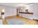 Spacious living room with hardwood floors and natural light offers a warm, inviting space at 6430 E Southport Rd, Indianapolis, IN 46237