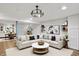 Well-furnished basement living area showcasing a comfortable sofa and stylish decor at 6430 E Southport Rd, Indianapolis, IN 46237