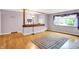 Bright living room featuring hardwood floors, a charming fireplace and lots of light at 6430 E Southport Rd, Indianapolis, IN 46237