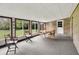 This sunroom features large windows providing beautiful views of the backyard at 6430 E Southport Rd, Indianapolis, IN 46237