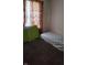 Modest bedroom featuring carpeted floors and natural light from the window at 6637 Larkwood Ct, Indianapolis, IN 46241