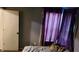Simple bedroom with an open curtained window, showing the sleeping area at 6637 Larkwood Ct, Indianapolis, IN 46241