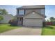Classic two-story home with a spacious two-car garage and lovely front yard at 6637 Larkwood Ct, Indianapolis, IN 46241
