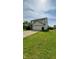 Two story home with attached two car garage, landscaping and mature trees at 6637 Larkwood Ct, Indianapolis, IN 46241