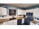 Bright kitchen with black appliances, contrasting countertops and sink window at 6637 Larkwood Ct, Indianapolis, IN 46241