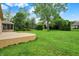 A shot of the backyard with a screened porch and a deck at 7310 Monaghan Ln, Indianapolis, IN 46217