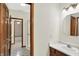 Bathroom with vanity sink, mirror and doorway views to other rooms at 7310 Monaghan Ln, Indianapolis, IN 46217