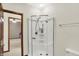 Bathroom with shower and view into bedroom at 7310 Monaghan Ln, Indianapolis, IN 46217