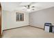 Bedroom with a window, fan, and carpet flooring at 7310 Monaghan Ln, Indianapolis, IN 46217