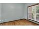 Bedroom with hardwood floors, a window, and neutral paint at 7310 Monaghan Ln, Indianapolis, IN 46217