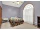Bedroom showcasing large window, neutral carpet, and purple walls at 7310 Monaghan Ln, Indianapolis, IN 46217