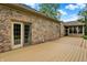 Wooden deck of a brick home with a view of the enclosed patio and backyard at 7310 Monaghan Ln, Indianapolis, IN 46217