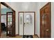 Welcoming foyer featuring a decorative front door and wood flooring at 7310 Monaghan Ln, Indianapolis, IN 46217