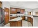 Traditional kitchen featuring wood cabinets and stainless steel appliances at 7310 Monaghan Ln, Indianapolis, IN 46217