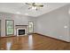 Bright living room with hardwood floors, fireplace, and neutral paint at 7310 Monaghan Ln, Indianapolis, IN 46217