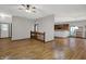 Open-concept living area showcases beautiful hardwood floors and flows seamlessly into the kitchen at 7310 Monaghan Ln, Indianapolis, IN 46217