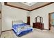 Comfortable main bedroom with tray ceiling and access to bathroom at 7310 Monaghan Ln, Indianapolis, IN 46217