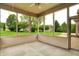 Enclosed patio showcasing serene views of the yard and surrounding neighborhood at 7310 Monaghan Ln, Indianapolis, IN 46217