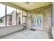 Covered patio with brick detail providing an outdoor living space with backyard views at 7310 Monaghan Ln, Indianapolis, IN 46217
