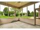 Enclosed patio showcasing serene views of the yard and surrounding neighborhood at 7310 Monaghan Ln, Indianapolis, IN 46217