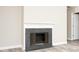 Cozy living room featuring a classic fireplace with stone surround at 7650 Micawber Ct, Indianapolis, IN 46256