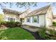 Charming home featuring blue shutters, a well-maintained lawn, and landscaped garden beds at 7650 Micawber Ct, Indianapolis, IN 46256