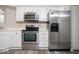 Modern kitchen featuring stainless steel appliances and white cabinetry at 7650 Micawber Ct, Indianapolis, IN 46256