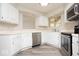 Efficient kitchen with bright cabinets and stainless-steel appliances at 7650 Micawber Ct, Indianapolis, IN 46256