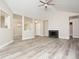 Large living room with vaulted ceilings and fireplace, perfect for entertaining at 7650 Micawber Ct, Indianapolis, IN 46256