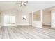 Bright, open living room featuring vaulted ceilings and sliding glass doors at 7650 Micawber Ct, Indianapolis, IN 46256