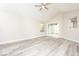 Spacious living area with new floors, a high ceiling, and sliding glass doors at 7650 Micawber Ct, Indianapolis, IN 46256