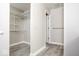 Spacious walk-in closet with shelving, hanging racks and laminate flooring at 7650 Micawber Ct, Indianapolis, IN 46256