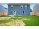 Exterior view of home showcasing the siding and backyard at 7918 Wolfgang Pl, Indianapolis, IN 46239