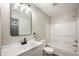 Bright bathroom with a shower-tub combo and elegant vanity at 7918 Wolfgang Pl, Indianapolis, IN 46239