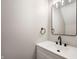 Modern bathroom featuring a sleek, black faucet and a stylish mirror at 7918 Wolfgang Pl, Indianapolis, IN 46239