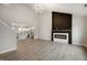 Spacious living room featuring a modern fireplace, open concept design, and abundant natural light at 7918 Wolfgang Pl, Indianapolis, IN 46239