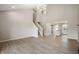 Bright living room with high ceilings, staircase, and an open layout at 7918 Wolfgang Pl, Indianapolis, IN 46239