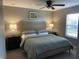 The bright bedroom has a queen size bed, carpeted floors, two bedside tables, and natural light at 8876 Boylan Pl, Pendleton, IN 46064