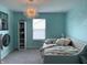 Bedroom features a stylish chandelier, floral wall art, and natural light from the window at 8876 Boylan Pl, Pendleton, IN 46064