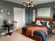 Modern bedroom featuring stylish decor, a comfortable bed, and contemporary lighting at 8876 Boylan Pl, Pendleton, IN 46064