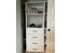 Open closet featuring built-in shelves and drawers for clothing and storage at 8876 Boylan Pl, Pendleton, IN 46064