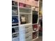 Organized closet featuring built-in shelving, drawers, and storage compartments at 8876 Boylan Pl, Pendleton, IN 46064