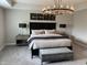 This main bedroom features neutral colors, a large bed, matching nightstands, and recessed lighting at 8876 Boylan Pl, Pendleton, IN 46064