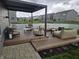 Outdoor patio with comfortable seating, modern pergola, and inviting fire pit at 8876 Boylan Pl, Pendleton, IN 46064