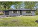 Charming grey ranch home with black trim, attached garage, and a nicely landscaped front yard at 8933 W 1050 S, Fortville, IN 46040